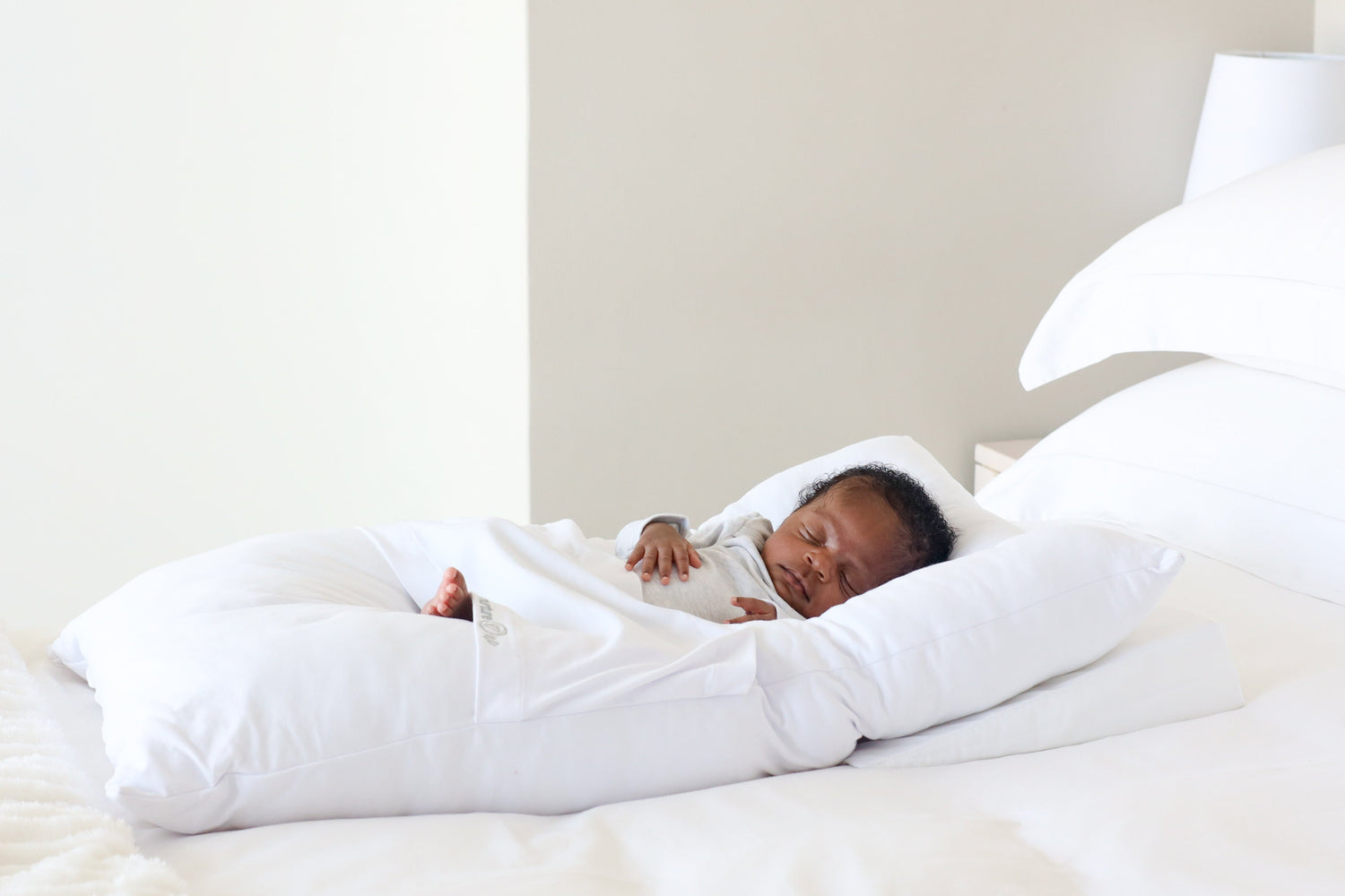 Sleeping Baby on a nurtureOne cushion